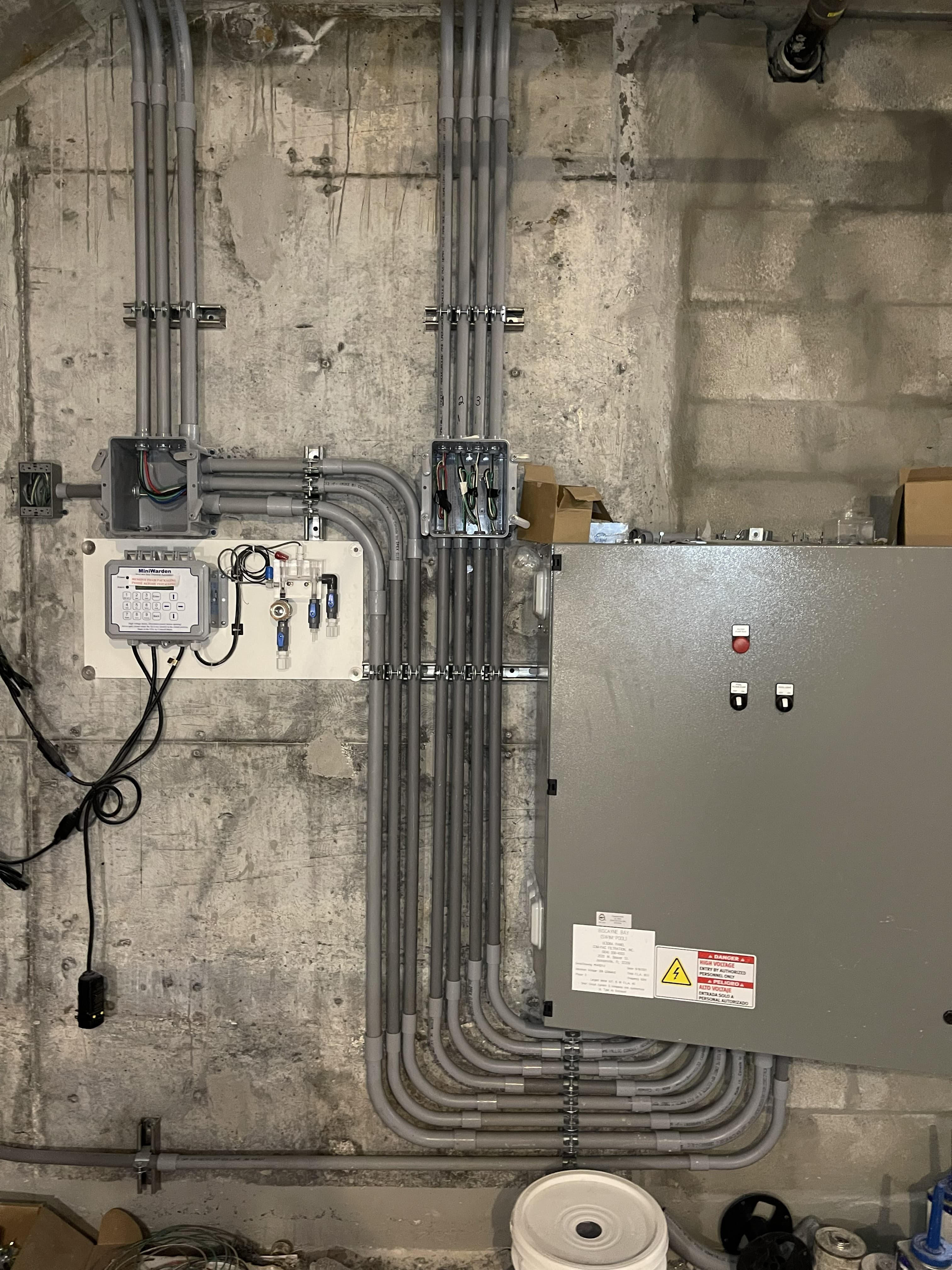 Equipment power and control panel with organized conduit installation
