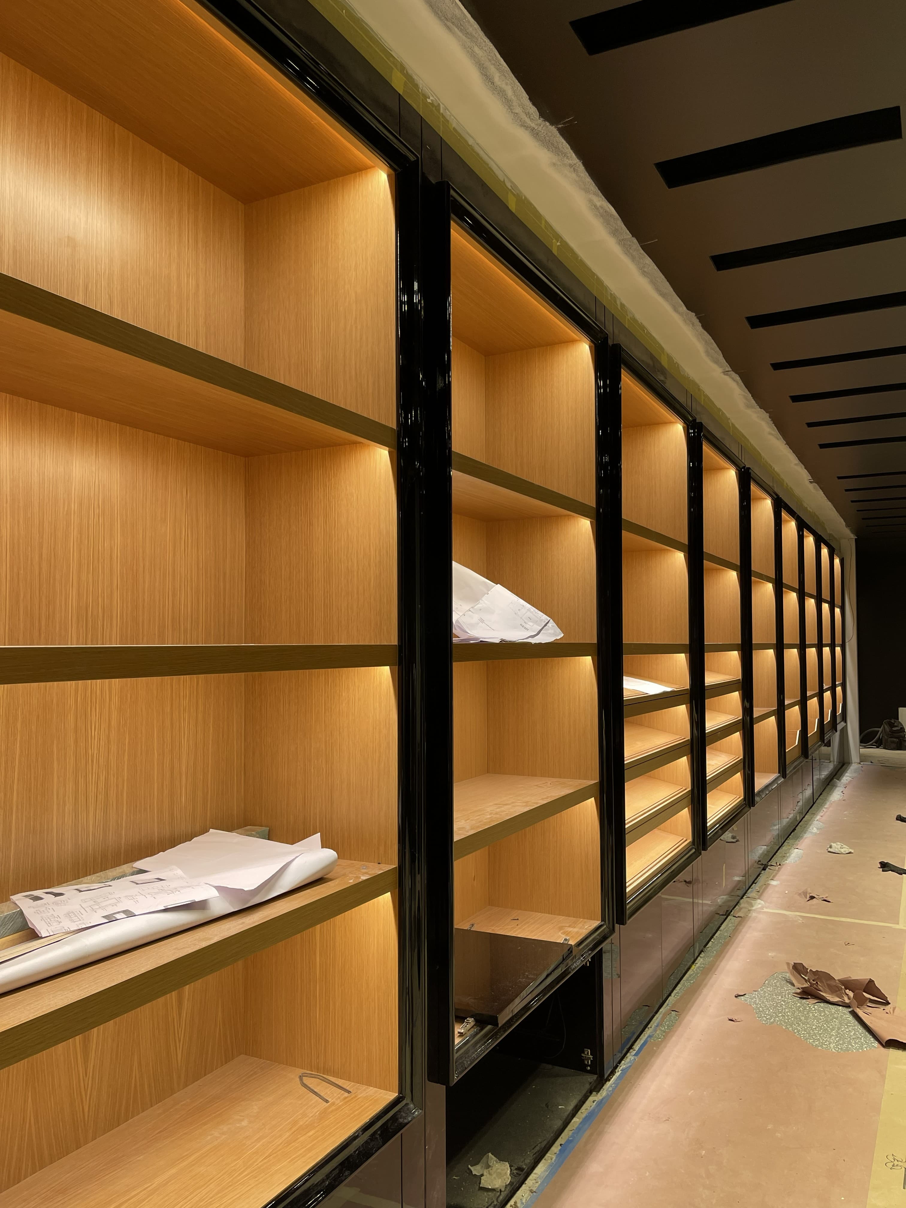 Finished retail interior with illuminated display millwork and shelving