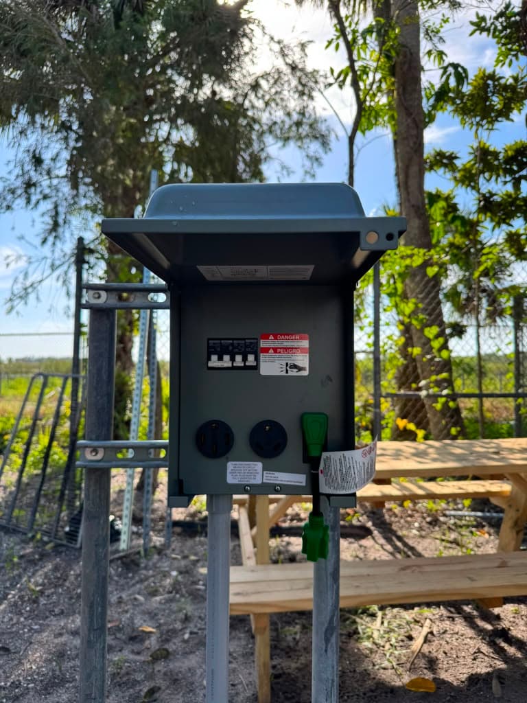 Outdoor power panel installed on a rural property, providing dedicated high-amperage outlets
