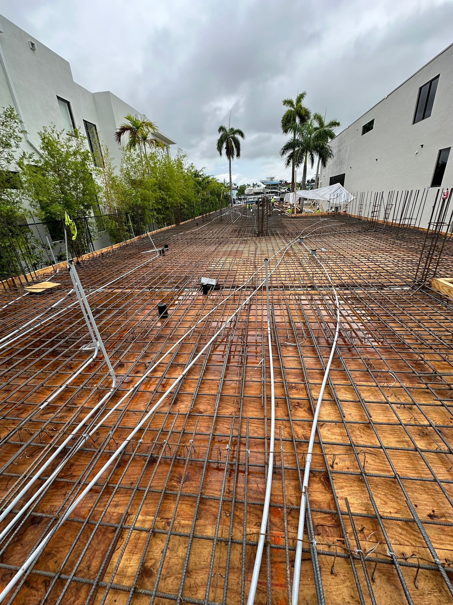 Electrical conduit stubbed up through foundation rebar at a new residential construction site
