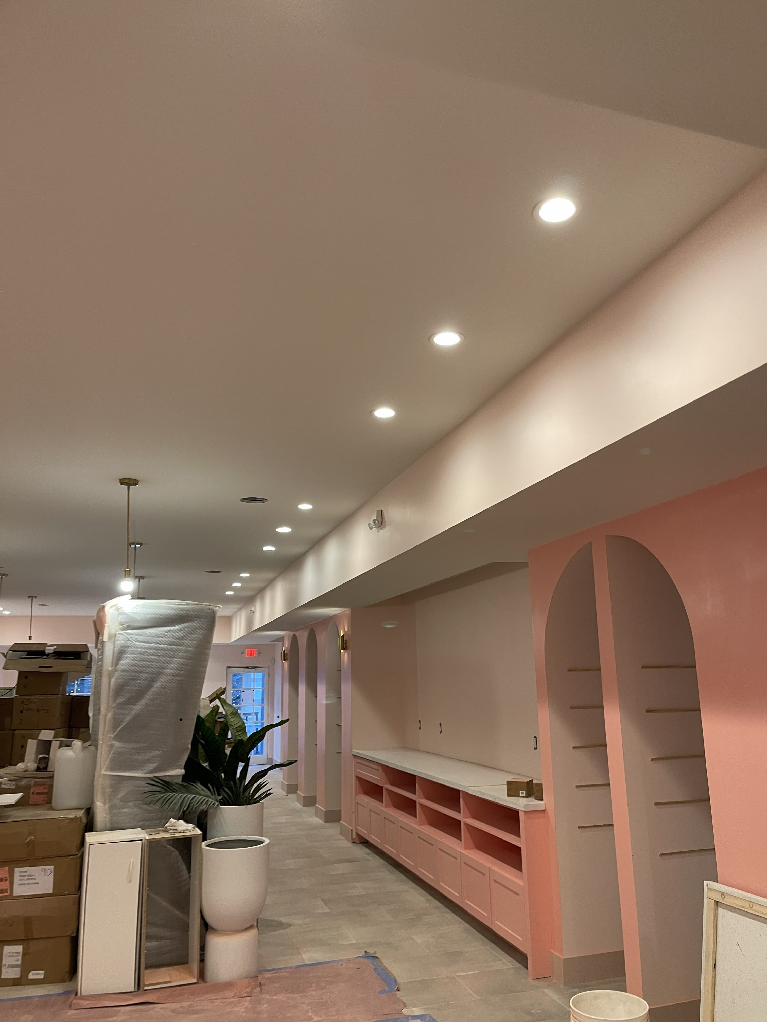 Finished retail interior with recessed lighting and custom cabinetry
