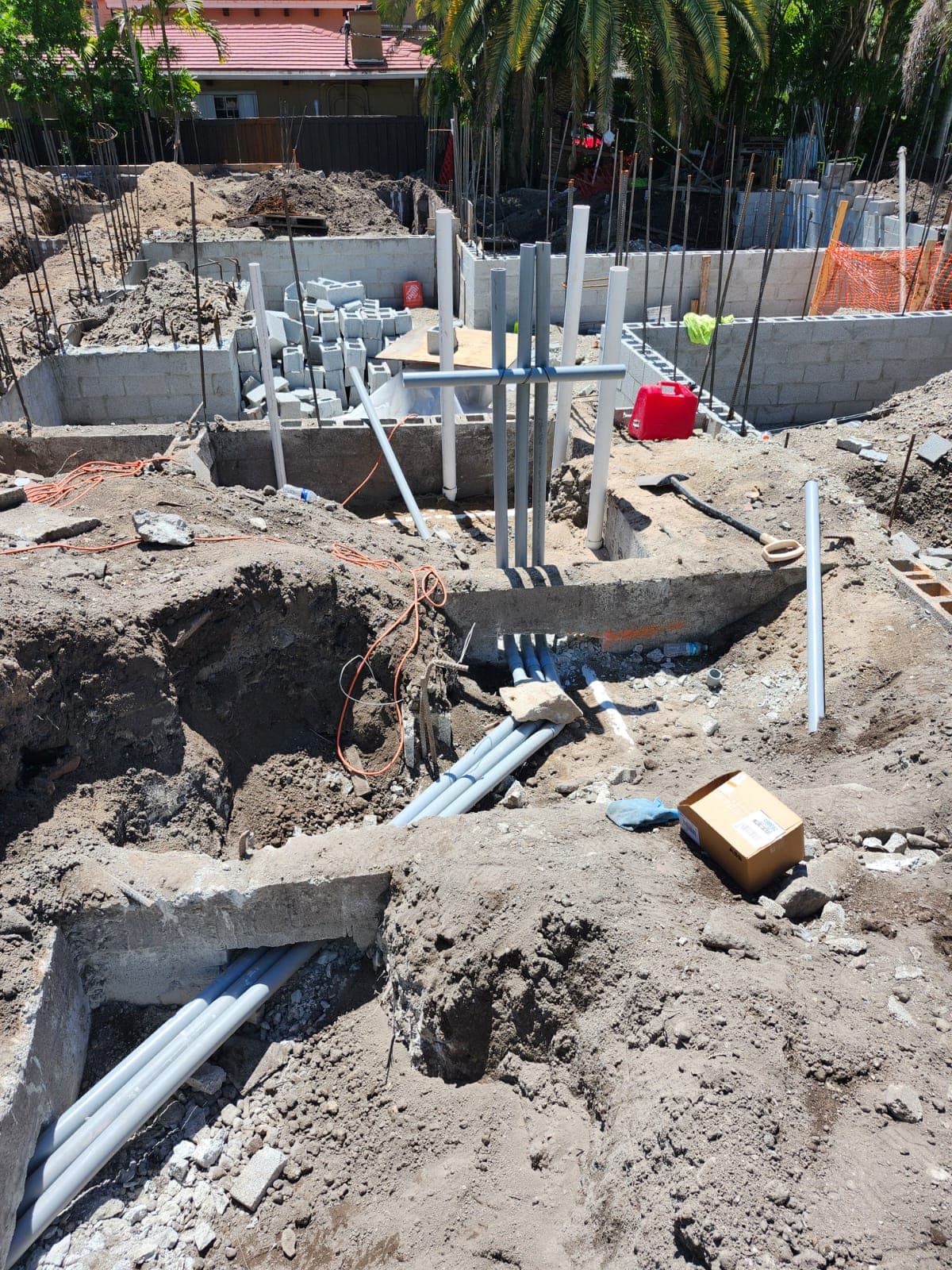 Underground electrical conduit installed during early foundation-stage construction