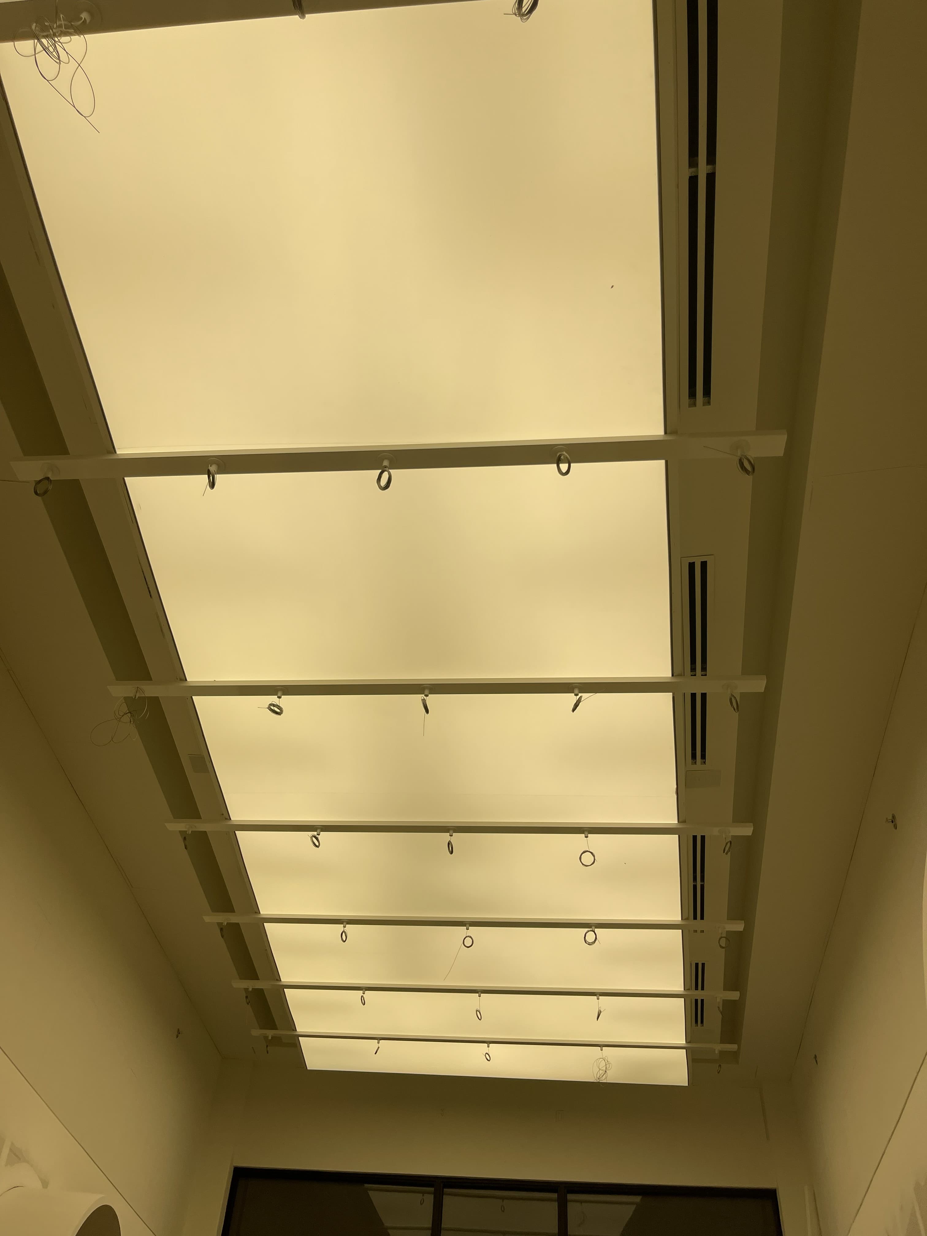 Lighting support rails and electrical wiring installed ahead of fixture installation