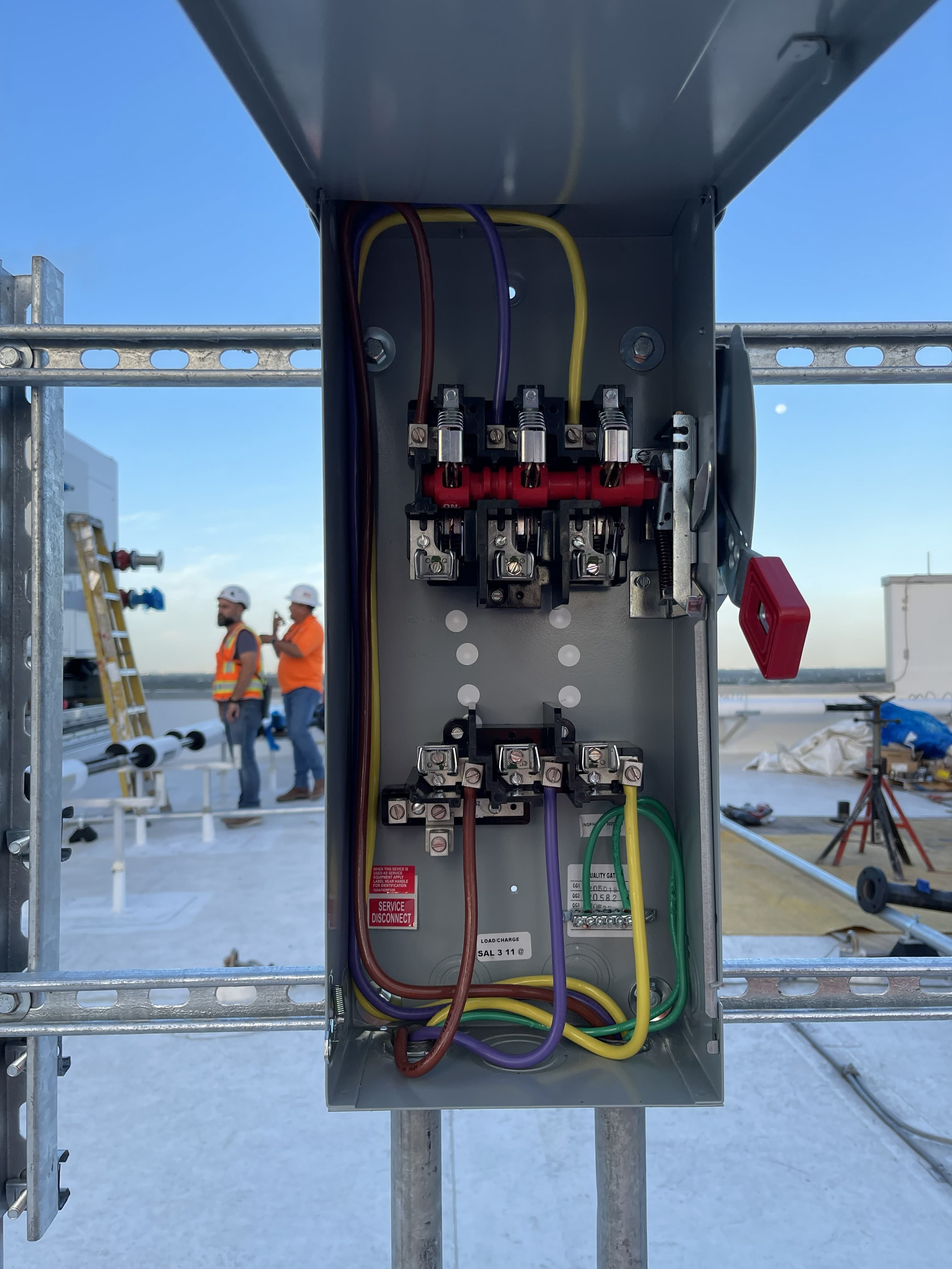 Close-up of electrical conductors landed on a disconnect terminal block