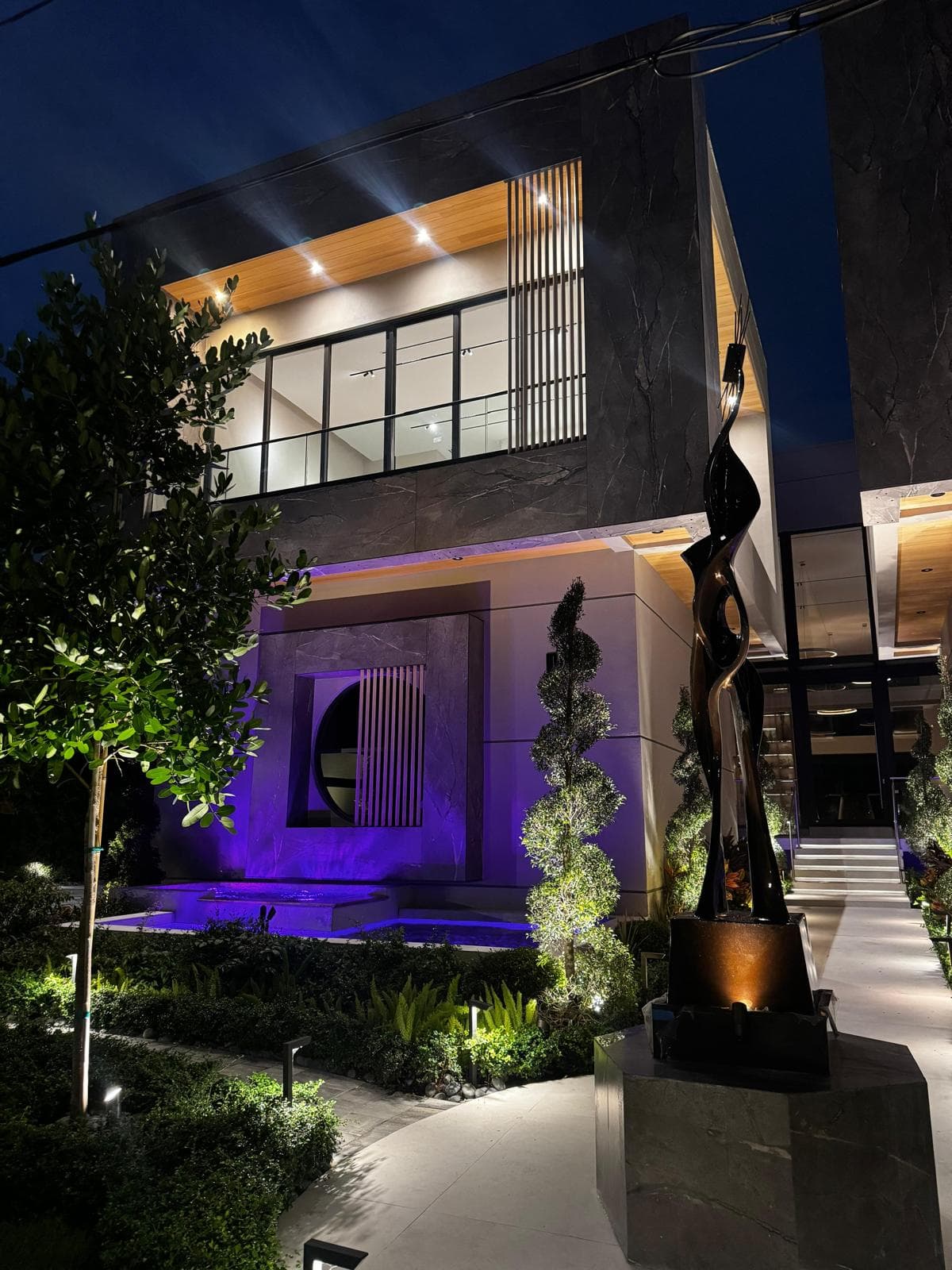 South Florida luxury residence with architectural exterior and landscape lighting